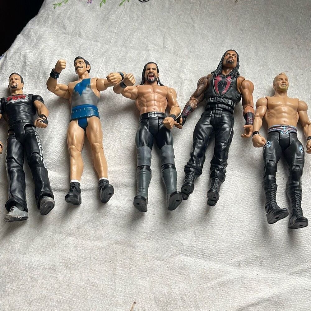 Lot of 5 WWE wrestling action figures Mattel one broken foot .